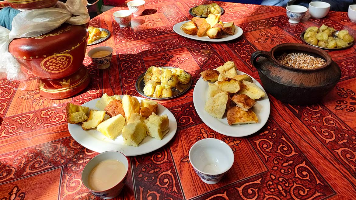 Tasting delicious snacks at local Tibetan family