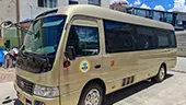 19-Seater Toyota Coaster Side View