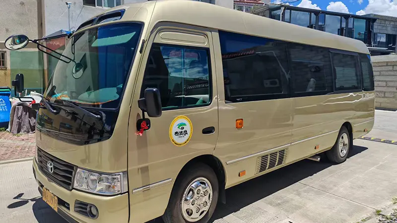 19-Seater Toyota Coaster Side View